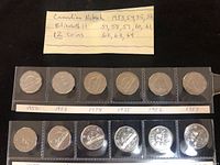 Full view of handwritten note and two strips containing twelve nickels