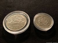Both coins obverse sides in capsules