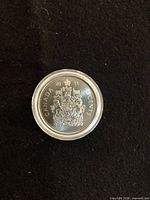 Obverse of 2011 Canadian 50 cent coin in capsule