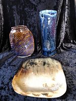 Full view of three pottery pieces together