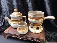 full set of five Laurentian Tundra pieces displayed on wooden stand