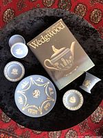 Group shot of all jasperware pieces and book