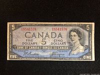 Obverse of 1954 Canada $5 note showing serial, signatures, denomination