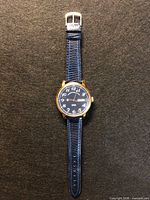 Full front view of watch showing strap, dial, case