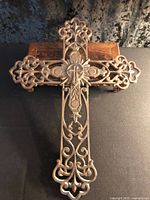 Front view of ornate cast iron cross