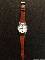 Front view of watch showing dial and strap