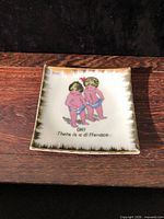 Front view showing illustration, gold border, overall condition