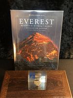 Book front cover and acrylic block on wooden surface