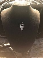 Pendant on display bust front view