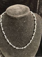 Necklace displayed on bust showing full strand