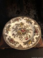 Front view of 11-inch Oriental Pheasants plate showing full pattern