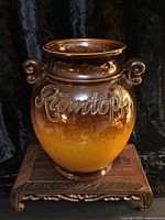 Front view of glazed Rumtopf crock showing lettering and color gradient