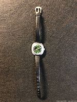 Front view showing entire watch, strap extended