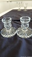Pair of crystal candlesticks front view