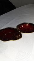 Two small red Carlton Ware dishes on table