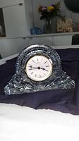 Front view of Waterford crystal mantel clock on table