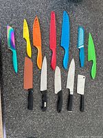 Front view of all 12 knives on countertop
