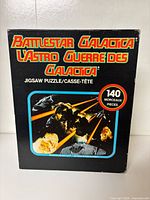 Front of Battlestar Galactica puzzle box showing artwork and piece count