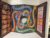Full view of unfolded three-panel Jumanji board showing playfield and graphics