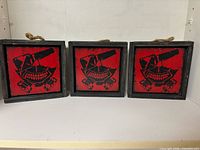 Front view showing all three framed Hydra plaques