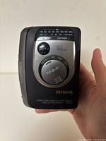 Front view showing model, dial, branding, and noted crack