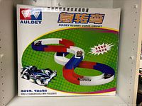 Front of box showing Auldey logo and Scurry Curve Circuit graphics