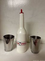 practice bottle centered with two shaker cups