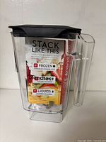 Front view showing jar, handle, lid, and instruction card