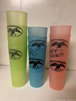 Stacked cups in three colours showing Duck Commander logos
