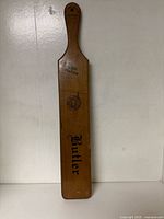 Front view showing Butler side with seal and lettering