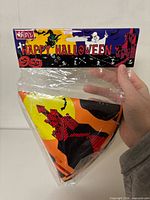 Full view of sealed package with header card reading Happy Halloween