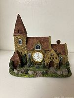 Front view of ceramic church-style building clock