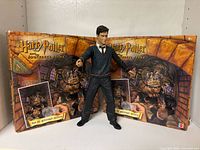 Figure standing in front of two puzzle boxes