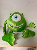 Front view of green Mike Wazowski plush showing full body