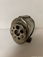 Front view showing dial with eight hole sizes and brand stamping