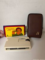 Optical Tapemeasure device, brown zip case, instruction leaflet