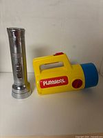 Playskool flashlight and Everest flashlight side by side