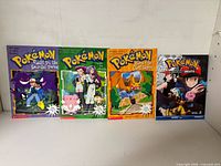 Four Pokémon Scholastic books arranged side by side