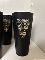 Front view of single tumbler showing Zodiac design