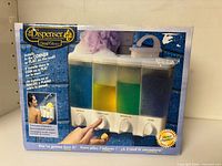 Front of boxed Better Living Clear Choice 3-chamber dispenser showing product image and features