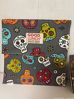 Front view of large snack sack showing sugar skull print and brand label