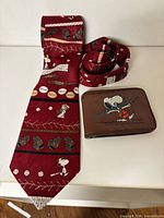 Red Snoopy baseball tie with brown Snoopy wallet