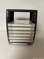 Front view of holder with seven Sony floppy disks visible