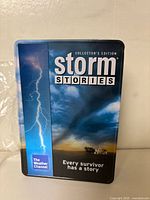 Front of Storm Stories Collector's Edition tin case