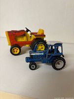 Tonka and Ford tractors side by side