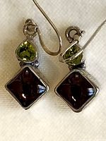 Front view showing peridot and amethyst stones in sterling settings