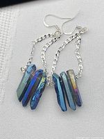 Both earrings showing quartz shards, silver chain and hooks