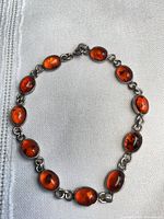 Full view of bracelet showing all amber cabochons and link style