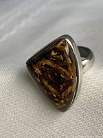 Ring front showing bronzite cabochon and silver bezel