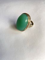 Oblique view of ring showing green chalcedony cabochon and bezel setting